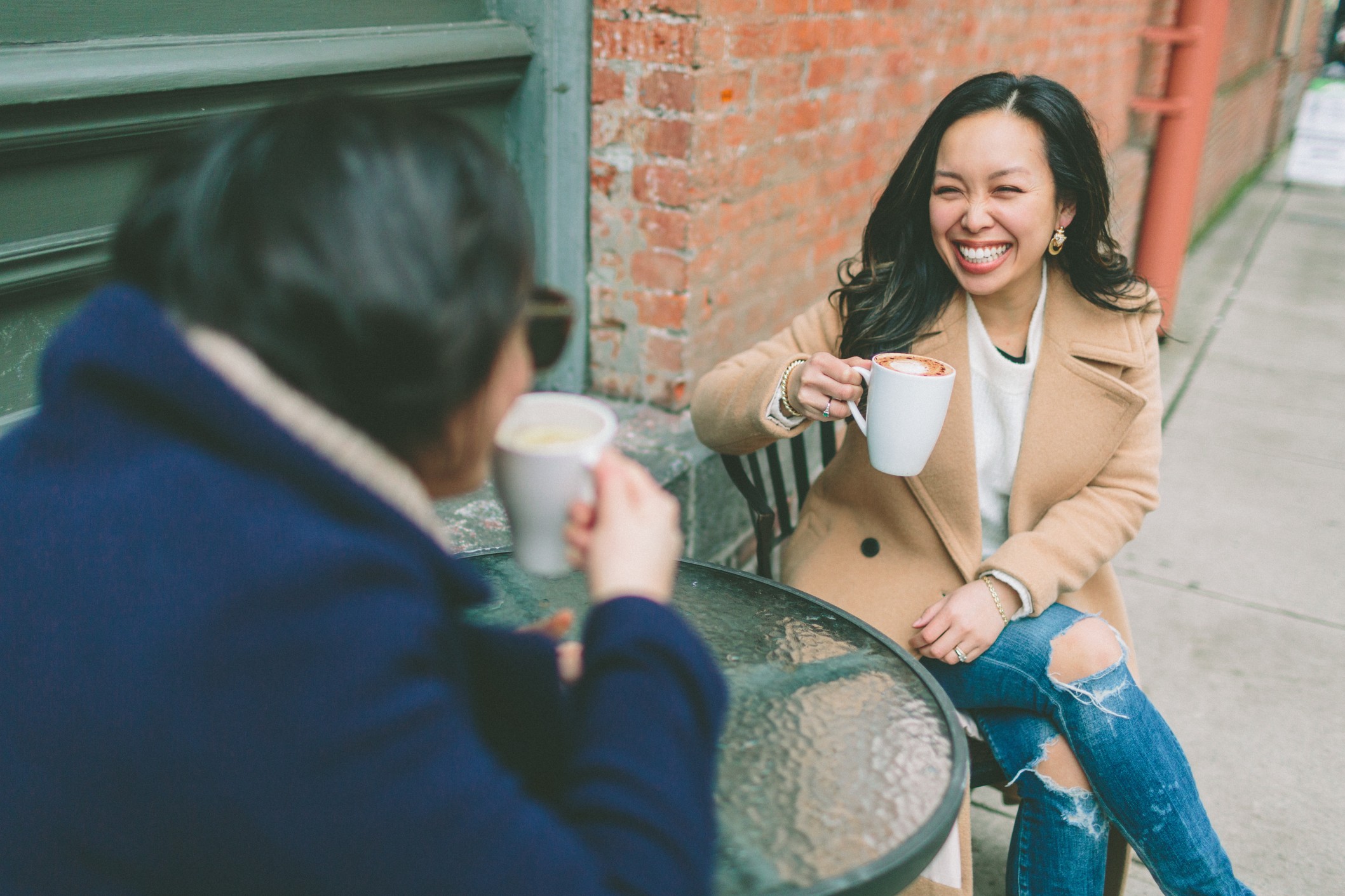 two women drinking coffee at restaurant while dwell time is tracking