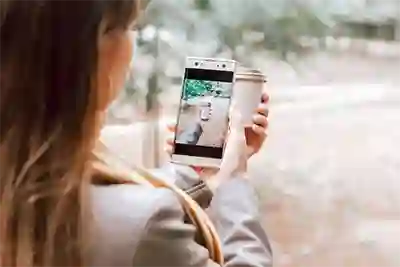 woman taking a picture of her coffee cup